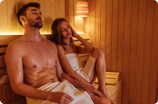 Couple relaxing in a sauna.