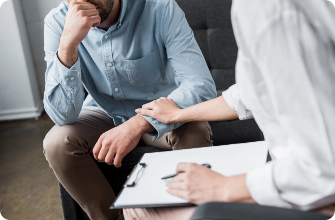 Doctor speaking with man about fertility.