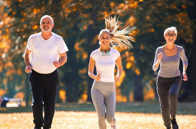 A family running together and exhibiting heart health
